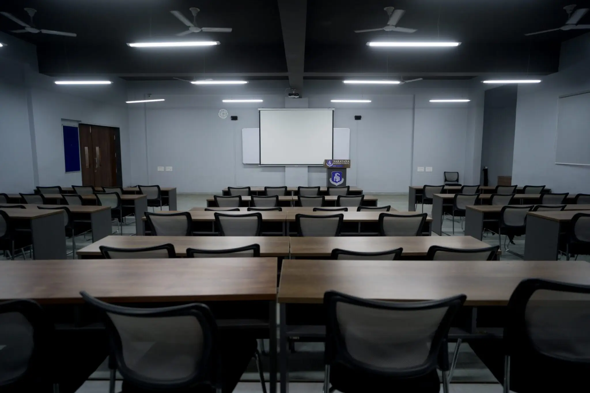 An image showcasing a classroom environment at Narayana Business School (NBS), featuring modern furniture and a conducive learning atmosphere.